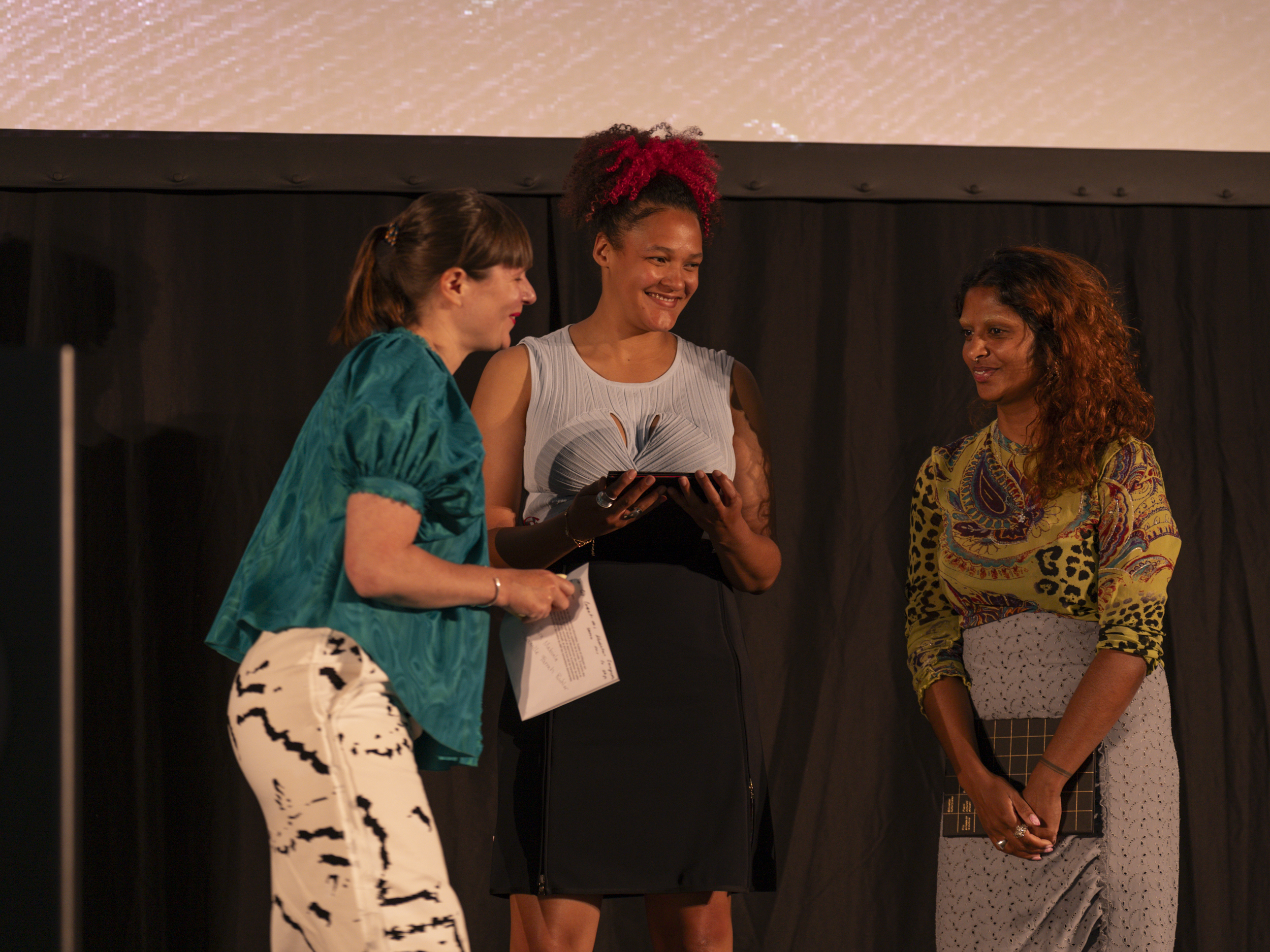 Evelyne Roth, jury member, and the awardees Front Row (Tara Mabiala, Camille Farah Buhler)